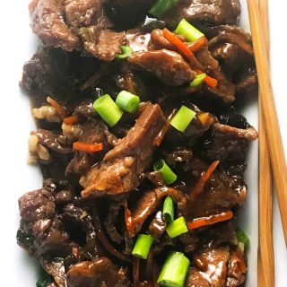 This easy slow cooker Mongolian beef is so simple to throw together. You've got flank steak, carrots, green onions, and spices that take center stage in this awesomely tasting slow cooker meal.