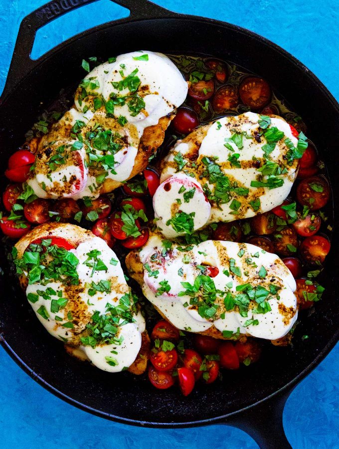 This caprese chicken with balsamic glaze takes less than 30 min to make, is made in one skillet, and tastes so dang delish. Great for a tasty and quick dinner!