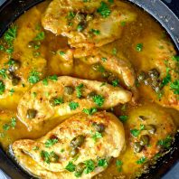 Best Chicken Piccata Ever | A chicken dish that is sautéed in butter and olive oil then served in a sauce with capers, lemon juice, butter, olive oil, and chicken stock. | sodamndelish.com