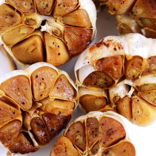 How to Roast Garlic - it really can’t get any easier than this simple recipe. Roasted garlic tastes creamy, sweet, and delish. Serve on top of toast or throw into any recipe that calls for garlic. | flipflopkitchen.com