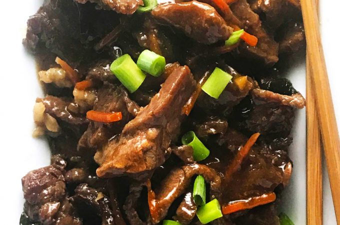 This easy slow cooker Mongolian beef is so simple to throw together. You've got flank steak, carrots, green onions, and spices that take center stage in this awesomely tasting slow cooker meal. 