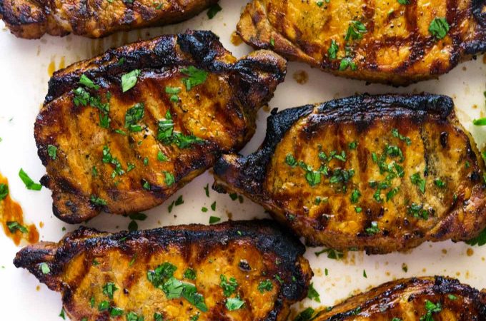 These super easy marinated grilled pork chops are marinated in soy, chicken broth, and spices then grilled to perfection. 