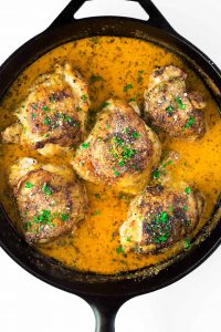 Lemon butter chicken thighs seared to perfection and finished in the oven in a finger-licking good garlic parmesan cream sauce. 